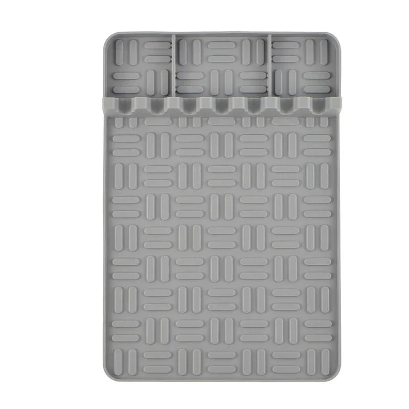Bbq Grill Tool Rest Mat - Top view of gray silicone tool rest mat with grooved surface and utensil holder slots