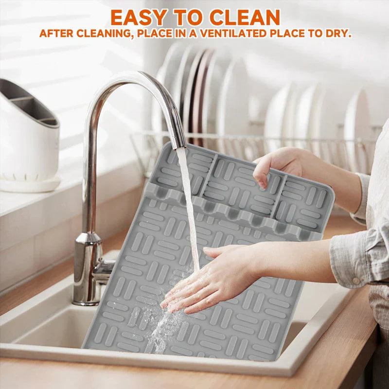 Bbq Grill Tool Rest Mat - Person washing a gray ridged silicone mat under a kitchen faucet, with text that reads EASY TO CLEAN above