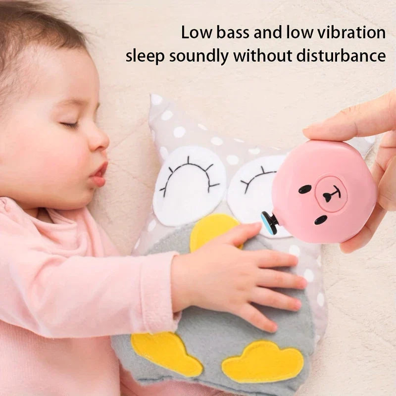 Electric Nail Trimmer File Kit - A sleeping baby lies near a plush owl toy, while a hand holds a pink bear-shaped nail grinder, with text about low bass and vibration.