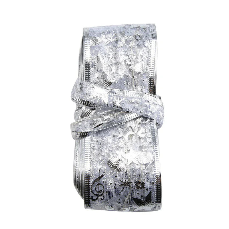 Battery Box - Coiled silver star-patterned LED ribbon string light roll on white background