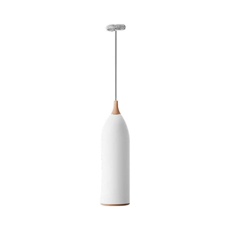 Battery operated frothing wand held over a cup of tea