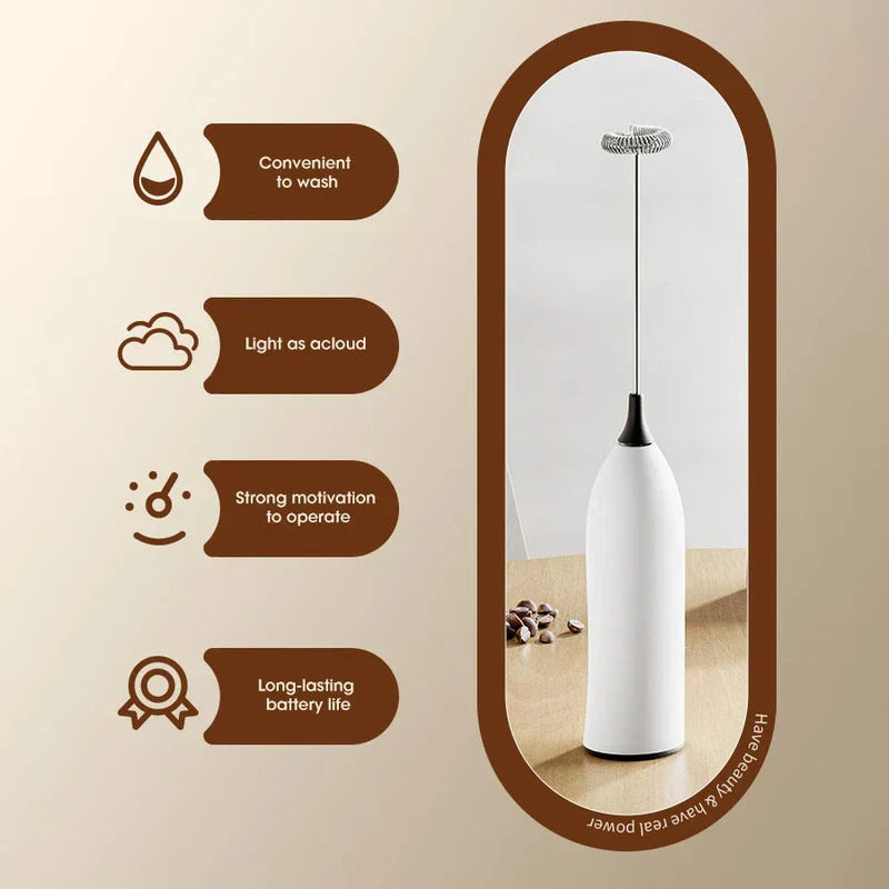 Close-up of frothing wand creating milk froth in a glass