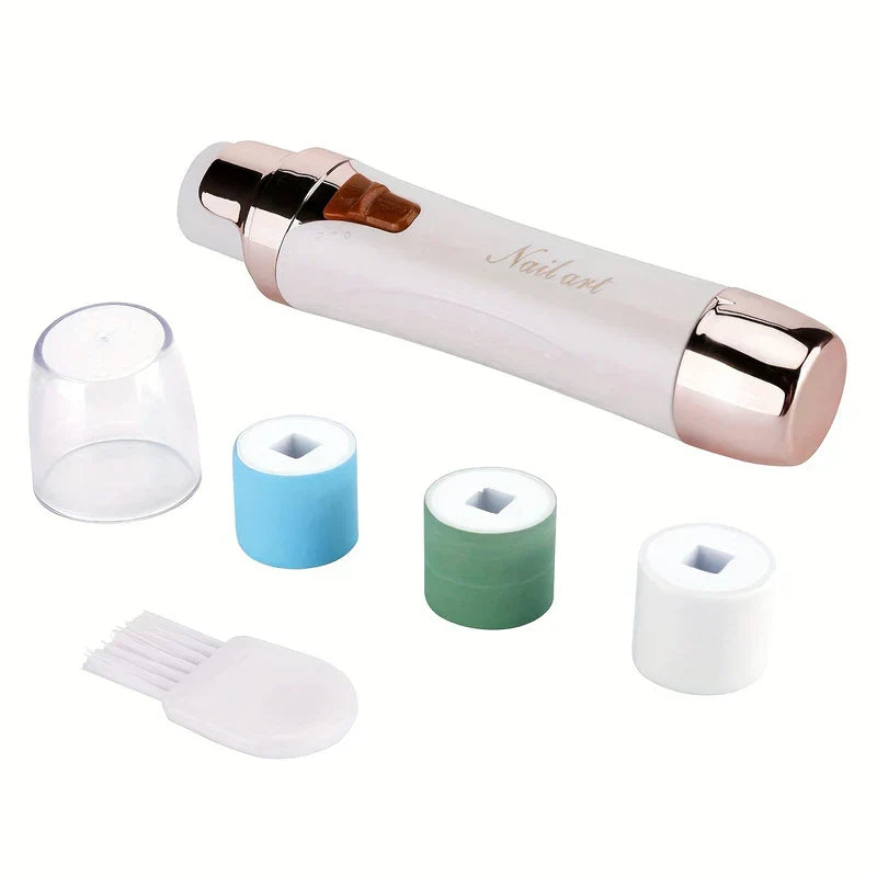Electric Nail Buffer - cordless nail care tool with attachments, clear cap, and cleaning brush laid out on white background