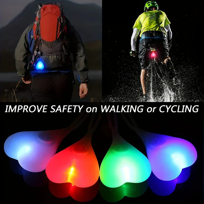 Led Bike Tail Rear Light - Split image: left person hiking with blue heart light on backpack, right cyclist with red heart bike light, bottom row of four colored glowing heart lights