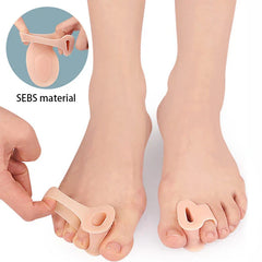 Flesh-toned foot pads worn on two feet, with a hand holding one pad; the pad has a toe loop, and 'SEBS material' text appears on the image.