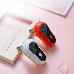 Pore Cleaner - Red and white handheld suction devices resting on white frames over pink surface