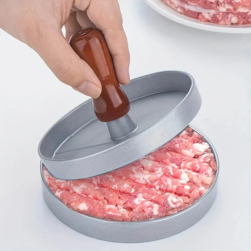 Burger Press Patty Maker Mold - hand pressing ground meat inside the mold with lid