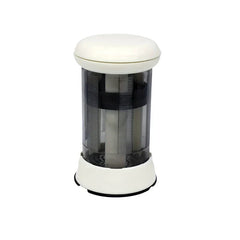 Butter Grater - white and clear cylindrical mill dispenser with white top and base on white background