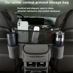 Car Center Console Organizer Hanging Bag - Gray car seat storage bag mounted between two front seats, holding a phone, bottles, and sunglasses