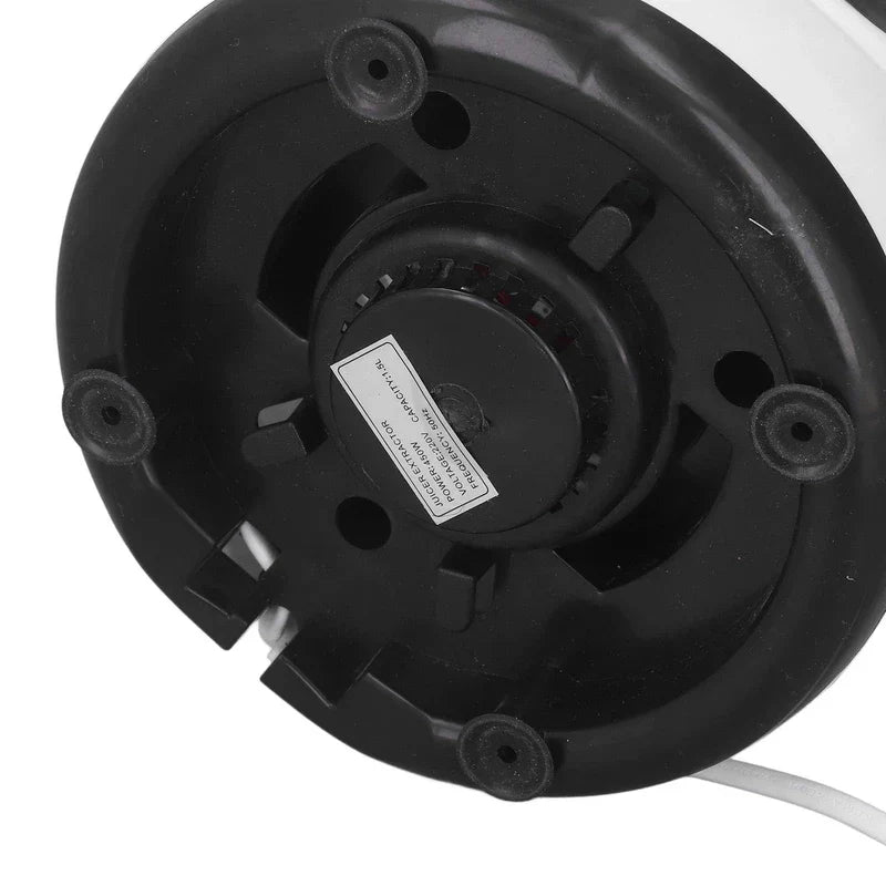 Centrifugal Juicer Machine - Bottom view of a small countertop appliance base with black plastic, four rubber feet, and a labeled central component