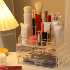 Plastic Storage Container - clear cosmetic organizer filled with skincare and makeup products on vanity table next to lamp
