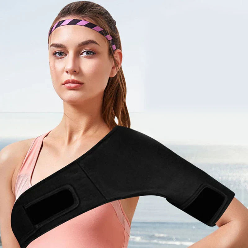 Shoulder Ice Pack - Person wearing black wrap brace on shoulder outdoors