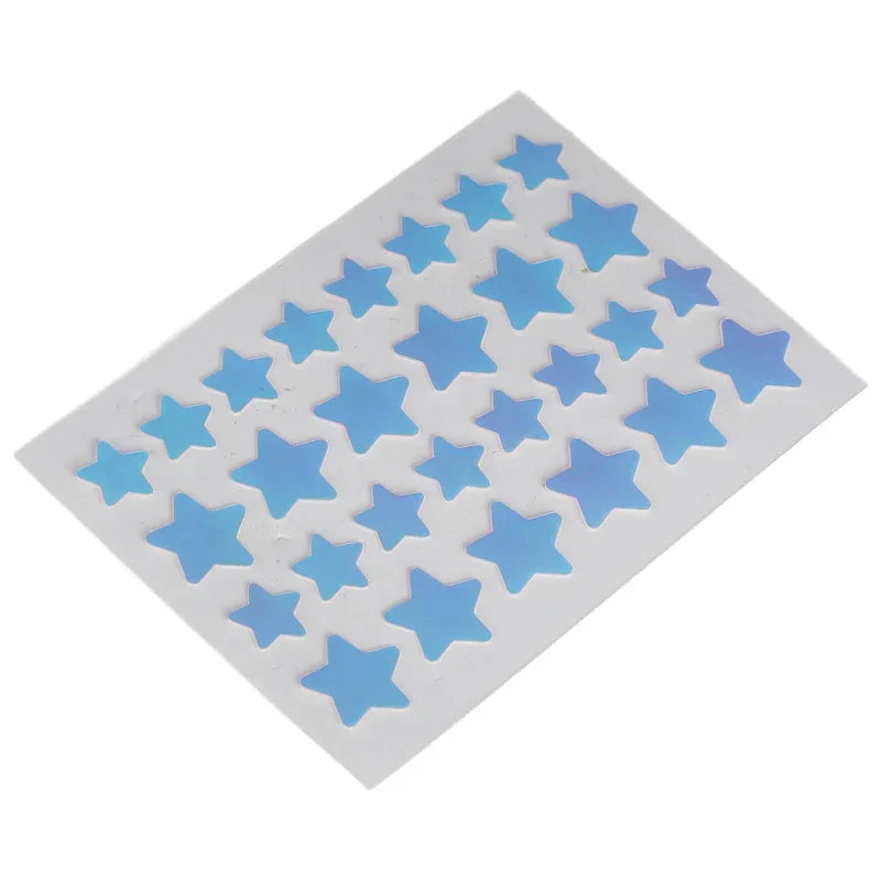 Colorful Hydrocolloid Acne Patches - Single sheet of blue star-shaped blemish patches on white backing