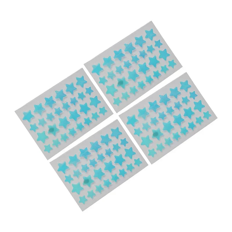 Colorful Hydrocolloid Acne Patches - Four sheets of light blue star-shaped blemish patches arranged diagonally