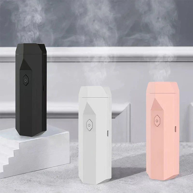 Aroma Diffuser Hair Brush - three units in black, white, pink colors with mist effect, styled display
