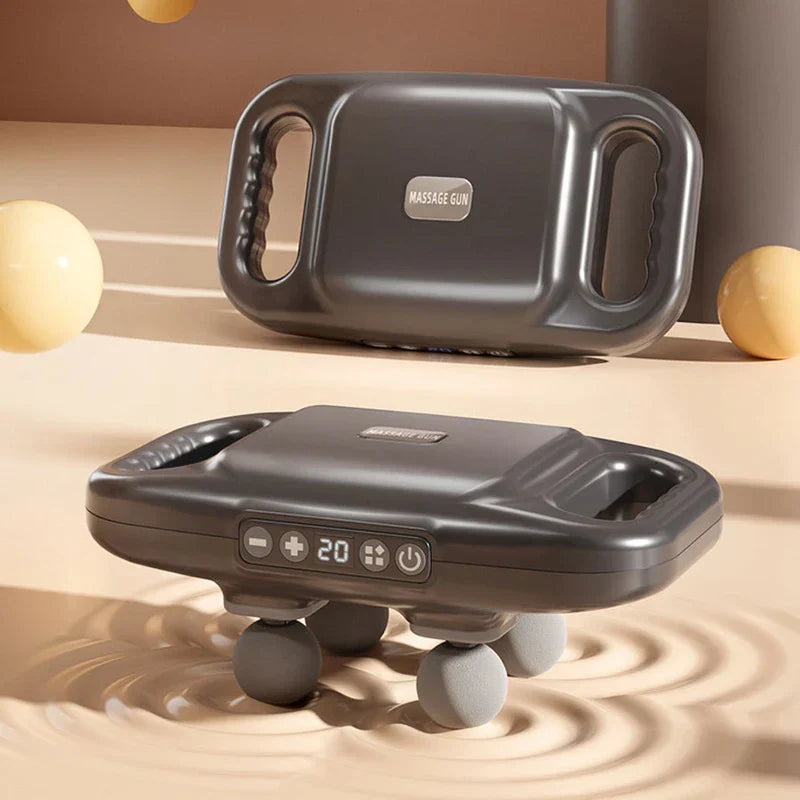 Compact Muscle - Two dark gray massage devices with dual handles, shown front and back on a beige textured surface