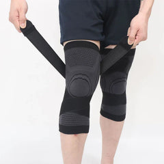 Compression Knee Sleeve - Person adjusting black compression knee sleeves with extra cross straps on both legs