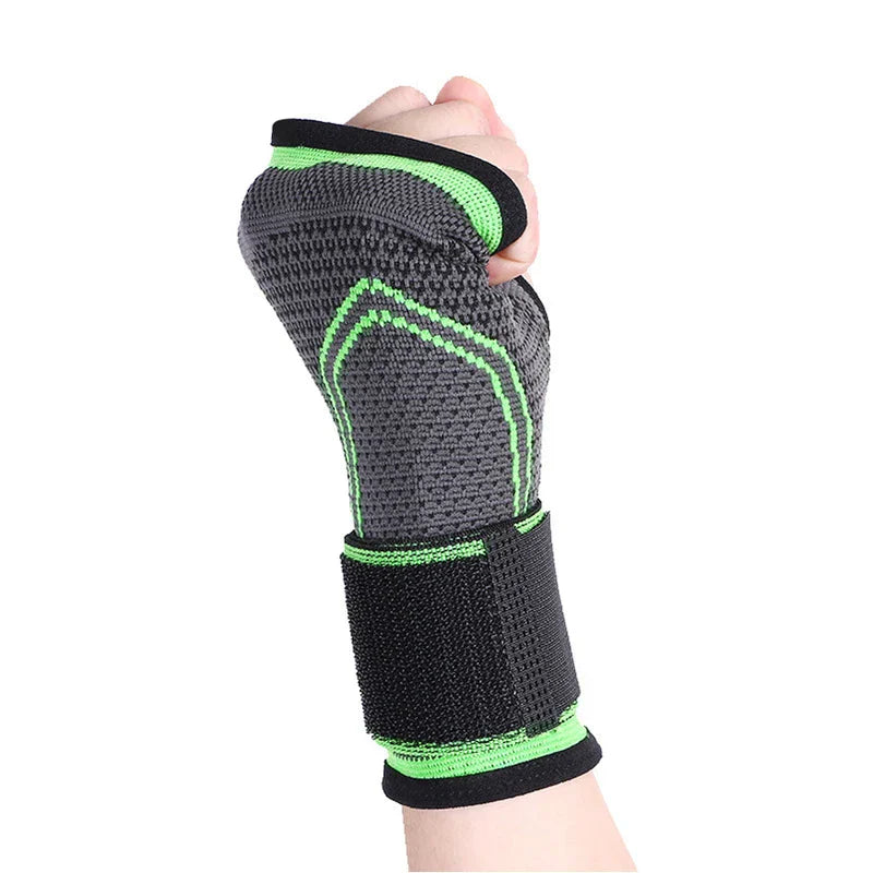 Compression Palm Hand Brace Glove - Grey and green knitted wrist brace worn on a clenched fist, with a black adjustable strap around the wrist.