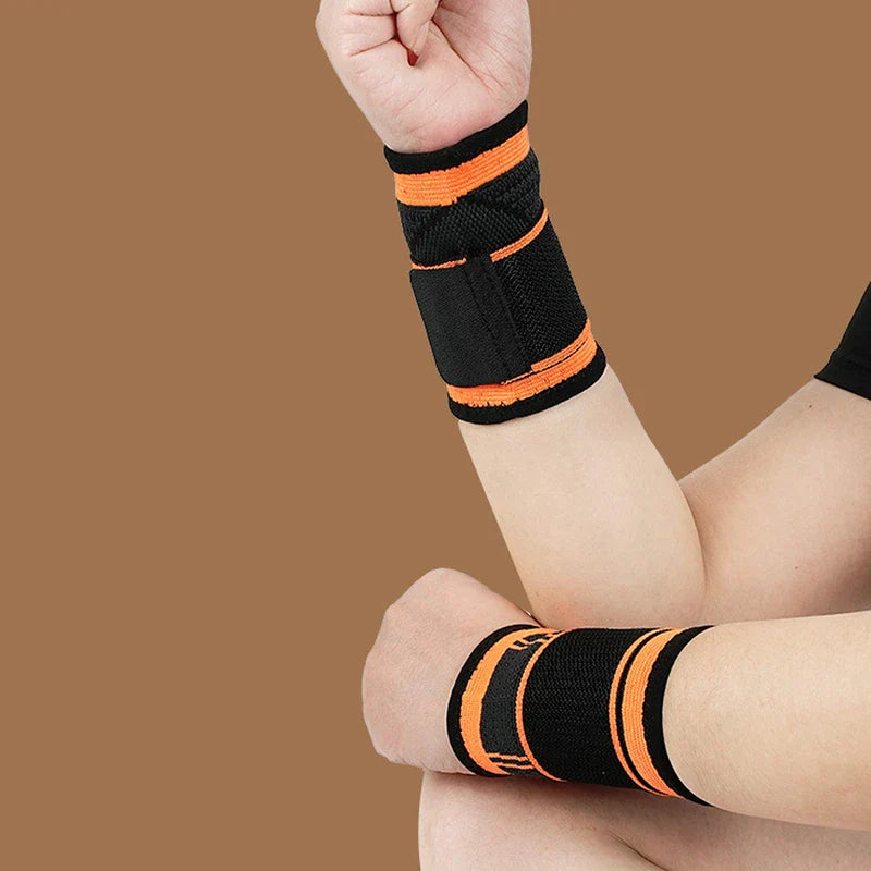 Compression Wrist Brace - Two arms with fists bent, wearing black wrist wraps with orange stripes, against a brown background.