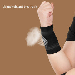 Compression Wrist Brace - Black wrist brace worn on a wrist with a mist graphic beside it, text reads Lightweight and breathable