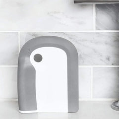 Countertop Dishwasher Machine - gray and white kitchen cleaning tool placed on countertop against marble tile backsplash