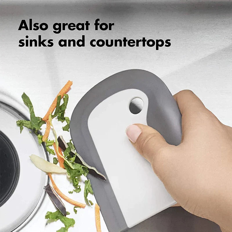 Countertop Dishwasher Machine - Hand holding a gray and white scraper pushing vegetable scraps on a stainless steel sink, with text 'Also great for sinks and countertops'
