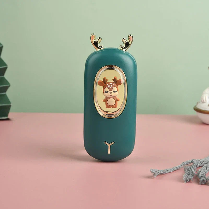 Rechargeable Hand Warmer - Dark green deer-themed handheld device with golden antlers, a brown deer figurine behind a clear oval window, and a small golden Y-shaped detail below