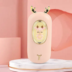 Rechargeable Hand Warmer - Light pink deer design unit with gold antlers and embedded pink deer figurine, displayed on a marble stand