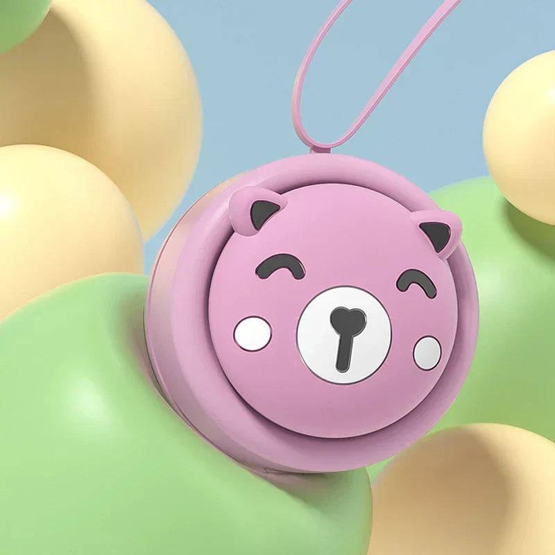 Neck Fan - Round pink bear-shaped hanging product resting on pale yellow and green rounded shapes against a light blue background