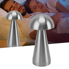 Accent Lamp - Two brushed silver mushroom-shaped lamps displayed against a bedroom scene with two people resting in bed