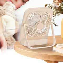 Desk Fan - Fan positioned on a round wooden bedside table near a resting person
