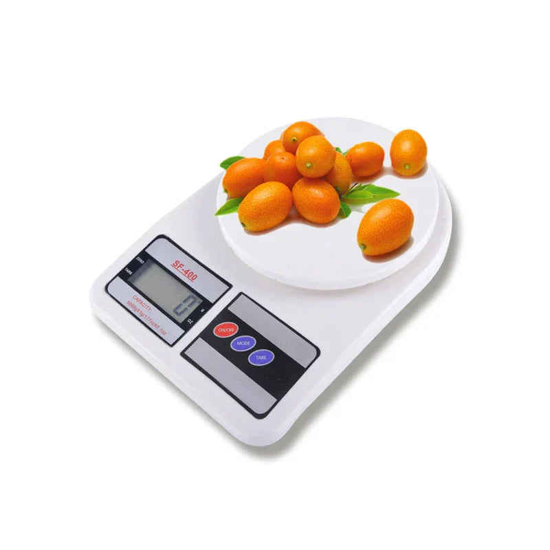 Digital Kitchen Scale - White SF-400 scale weighing fresh kumquats with leaves on its round weighing platform