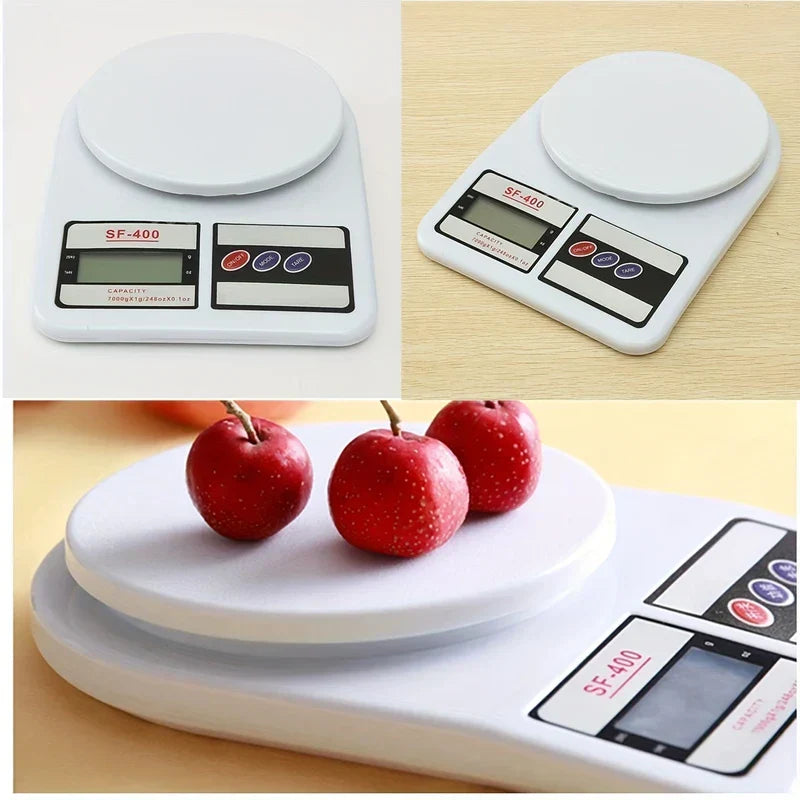 Three views of the white digital kitchen scale, including two angled shots and a close-up of red fruit on its weighing platform.
