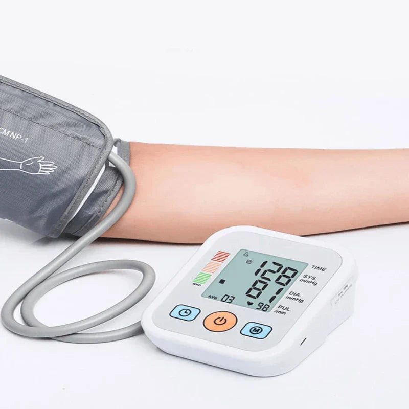 Upper arm cuff blood pressure monitor being worn on arm