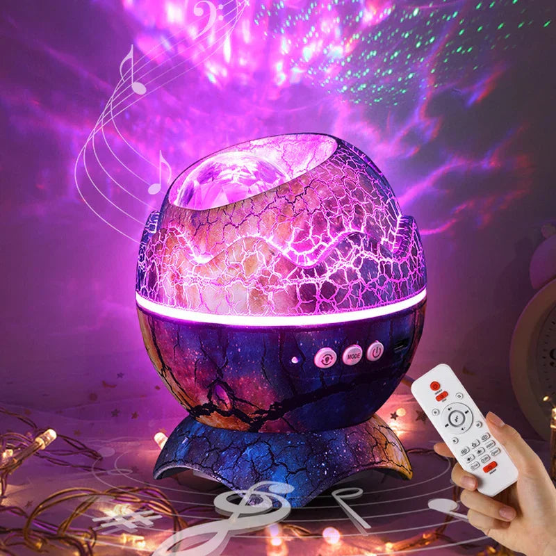 Star Projector Light - Galaxy-colored cracked egg projection device lit with purple star projection, with a hand holding a remote control pointed at it.