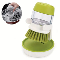 Dish Brush - Soap dispensing cleaning brush on its holder, with inset showing the brush scrubbing a soapy pan