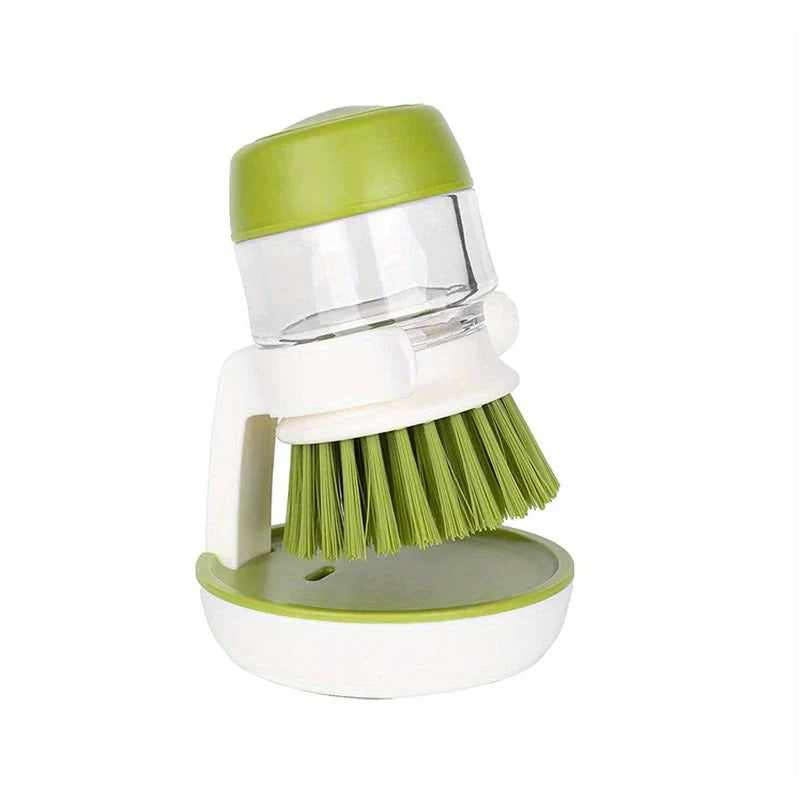Dish Brush - Soap dispensing cleaning brush positioned upright in its storage holder against a plain white background
