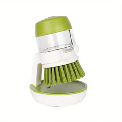 Dish Brush - Soap dispensing cleaning brush positioned upright in its storage holder against a plain white background
