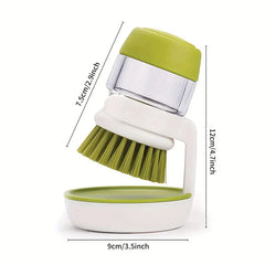 Green and white soap dispensing dish brush on its stand, with size dimension lines marked on a white background
