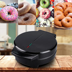 Mini Donut Maker - Closed black donut maker sitting on a wood countertop, with example donut images shown above it