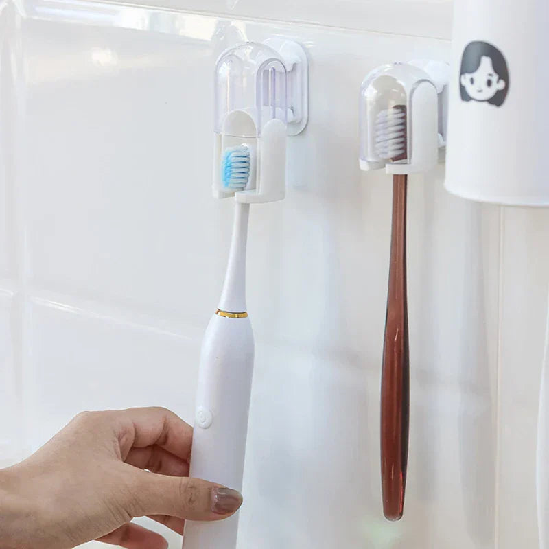 Toothbrush Holder - Close-up of a hand placing an electric toothbrush into a wall-mounted holder with a transparent cover