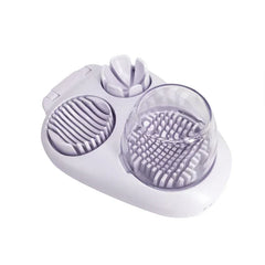 Egg Slicer - 3-in-1 kitchen tool with slice, wedge, and dice cutting compartments on white base