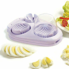 Light purple three-in-one egg slicer with sliced, wedged, and diced hard boiled egg pieces, and a partial salad plate.