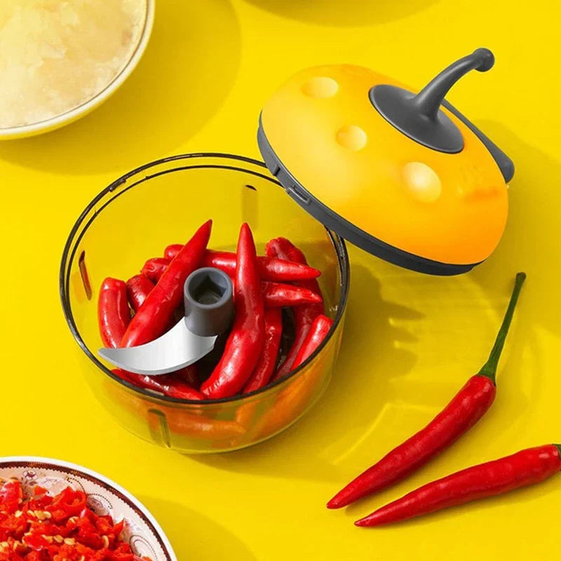 Smoothie Maker - Open chopper bowl filled with whole red chili peppers, showing internal stainless steel cutting blade