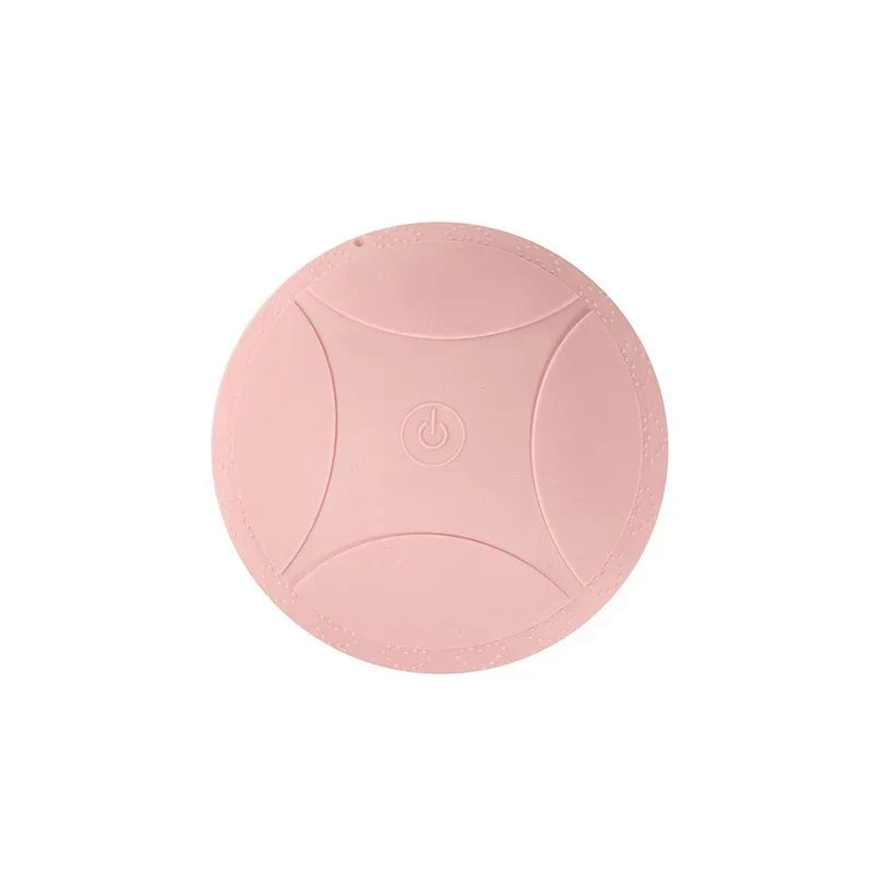 Massager Bra - Blush pink circular massage unit with embossed power button at center