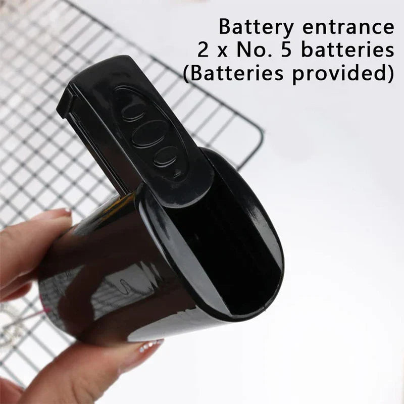 Mixer - Close-up of the battery compartment of a handheld electric whisk, held by a hand with fingernail detail