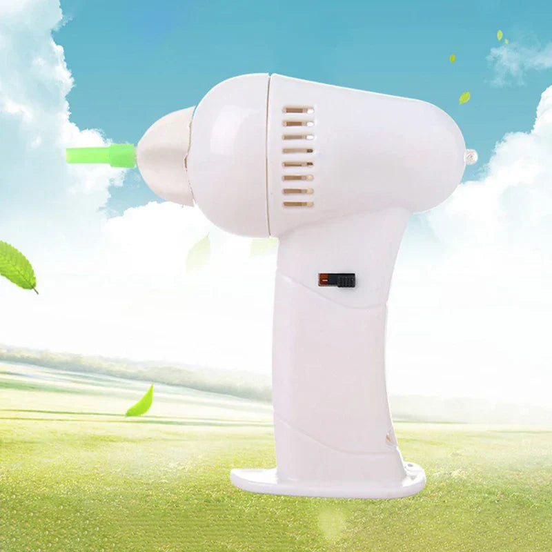 Ear Wax Kit Removal - White handheld electric ear cleaner with green tip against sky and grass background