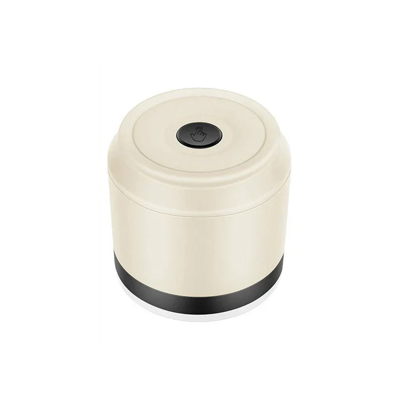 Electric fabric shaver lint remover held near a sweater