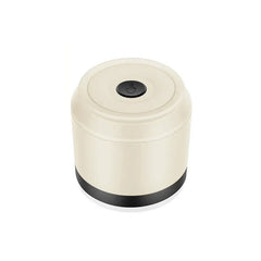 Electric fabric shaver lint remover held near a sweater