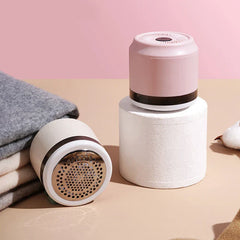 Close-up of the lint remover device on a fabric surface